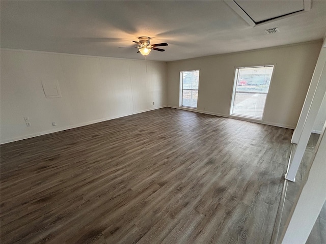 unfurnished room featuring ceiling fan and dark wood-type flooring