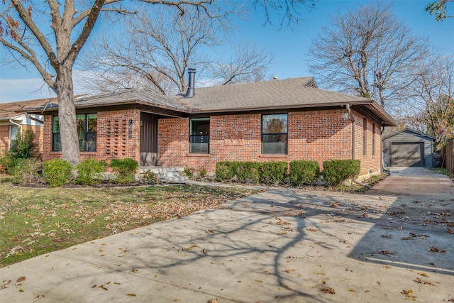 single story home with a garage and an outdoor structure