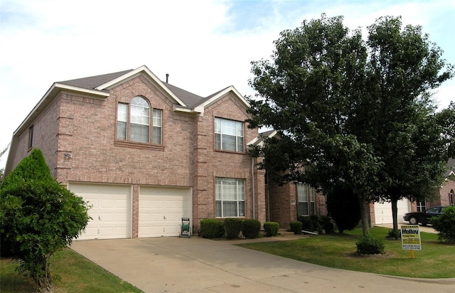 view of front facade with a front lawn and a garage