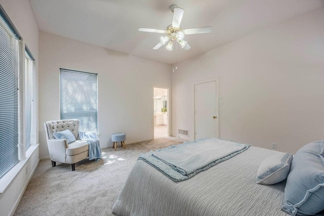 bedroom with ceiling fan and light colored carpet