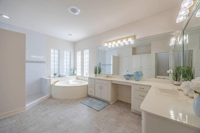 bathroom featuring vanity and separate shower and tub