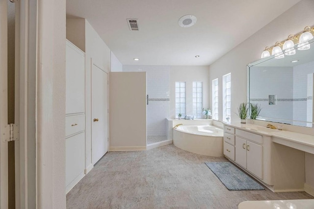 bathroom with independent shower and bath and vanity