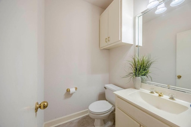 bathroom with toilet and vanity