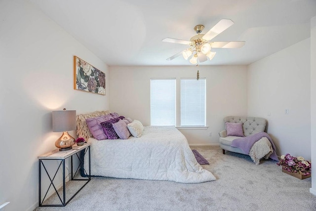 bedroom featuring light carpet and ceiling fan