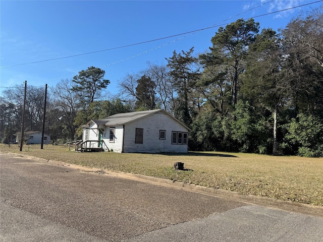 view of side of property with a yard