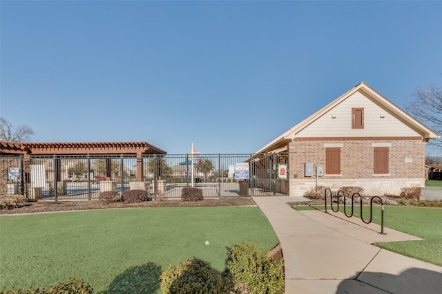 view of home's community featuring a lawn