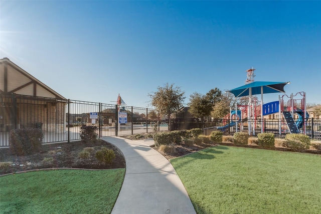 surrounding community with a yard and a playground