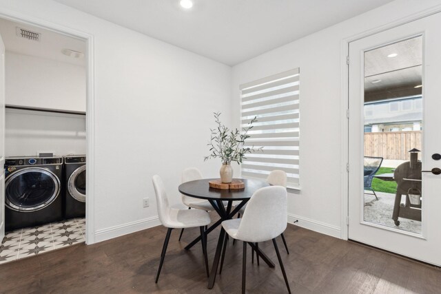 dining room with separate washer and dryer and dark hardwood / wood-style flooring