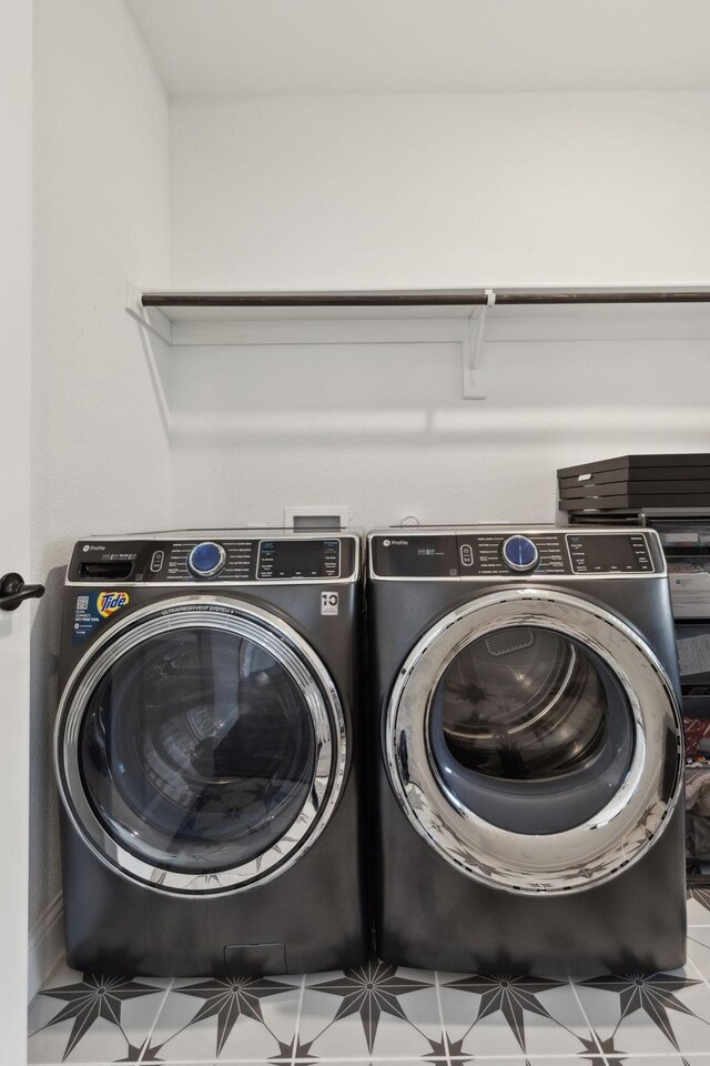 laundry area with washer and dryer