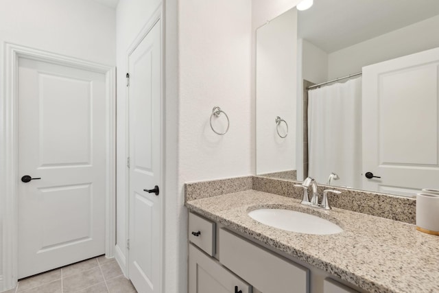 bathroom featuring vanity and tile patterned flooring