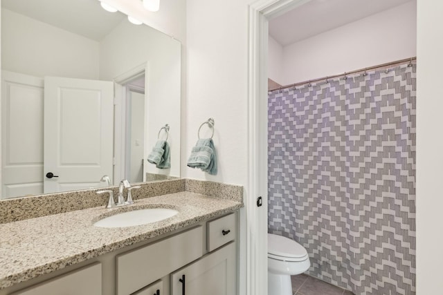 bathroom featuring curtained shower, tile patterned flooring, vanity, and toilet