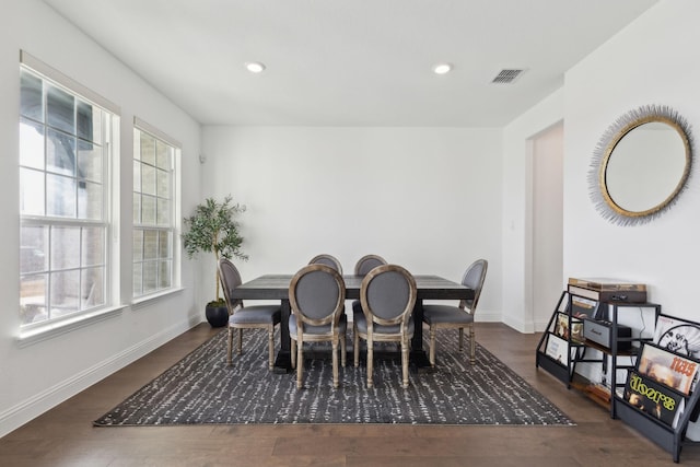 dining space featuring dark hardwood / wood-style floors