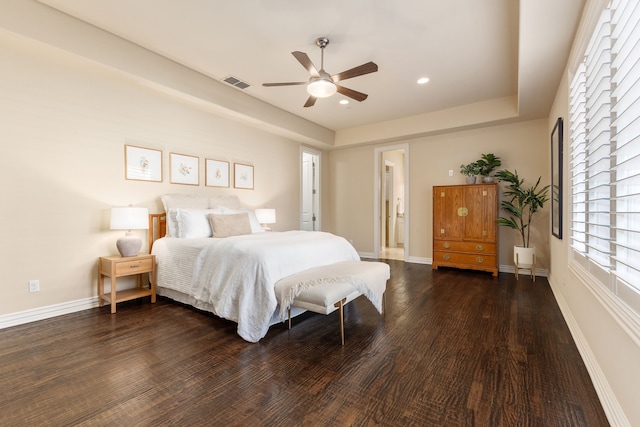 bedroom with ceiling fan and dark wood-type flooring