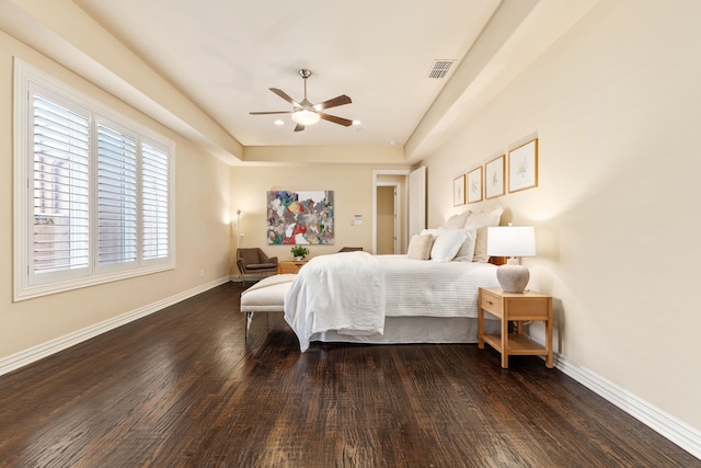 bedroom featuring ceiling fan and dark hardwood / wood-style flooring