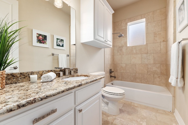 full bathroom featuring toilet, vanity, and tiled shower / bath combo