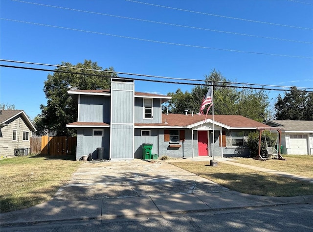 view of front of house with central AC and a front lawn