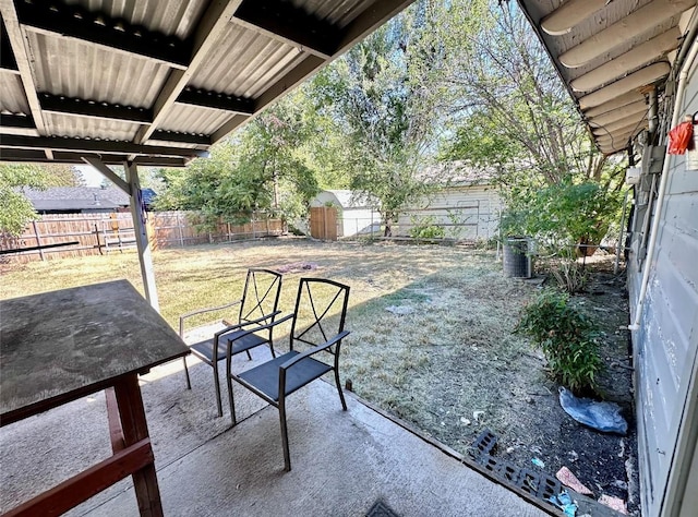 view of patio with a storage shed