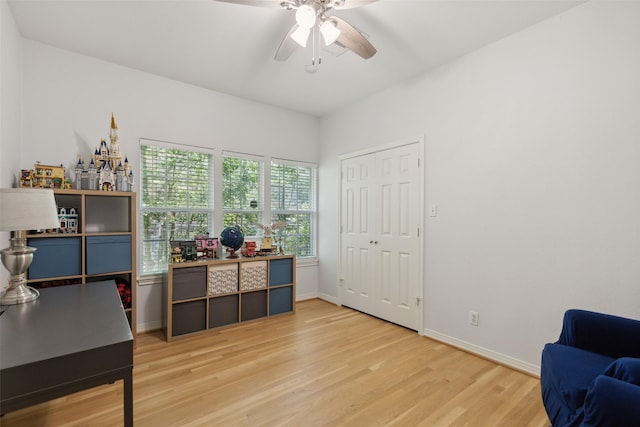 office area featuring wood-type flooring and ceiling fan