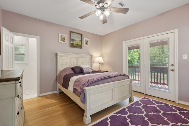 bedroom with access to exterior, ceiling fan, and light hardwood / wood-style floors