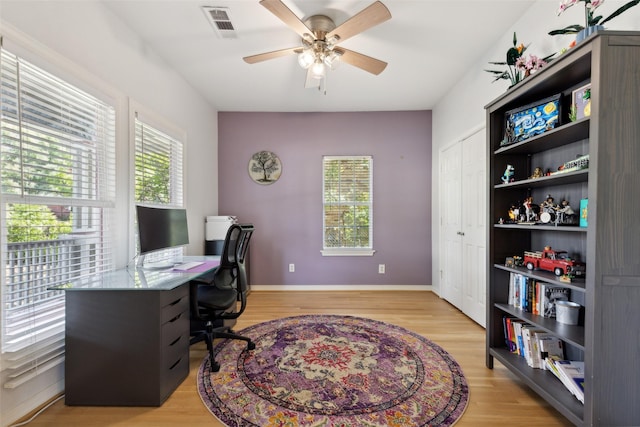 office area with ceiling fan and light wood-type flooring