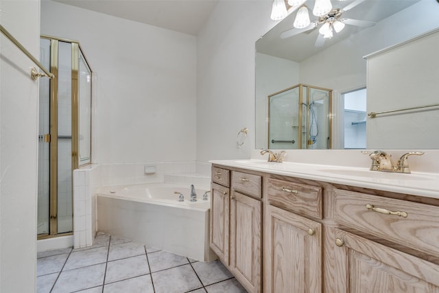 bathroom featuring ceiling fan, vanity, plus walk in shower, and tile patterned floors