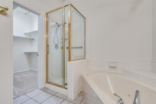 bathroom with separate shower and tub and tile patterned floors