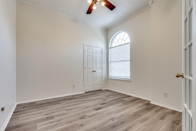 unfurnished room with ornamental molding, ceiling fan, light hardwood / wood-style floors, and plenty of natural light