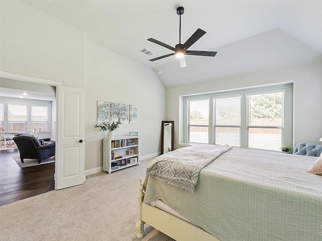 bedroom featuring lofted ceiling, ceiling fan, and carpet