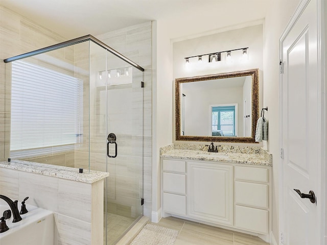 bathroom with tile patterned flooring, shower with separate bathtub, and vanity