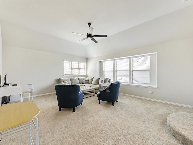 carpeted living room featuring ceiling fan and vaulted ceiling