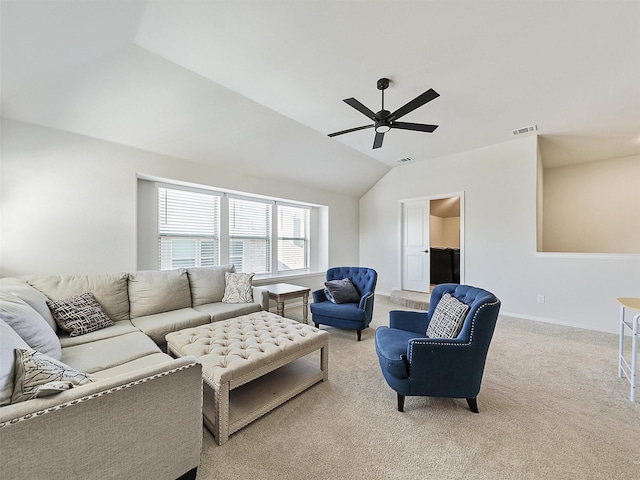 carpeted living room featuring ceiling fan and lofted ceiling