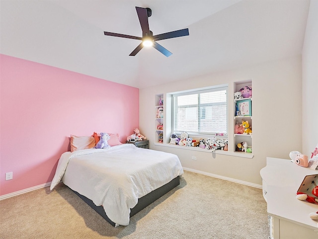 bedroom with ceiling fan and light carpet