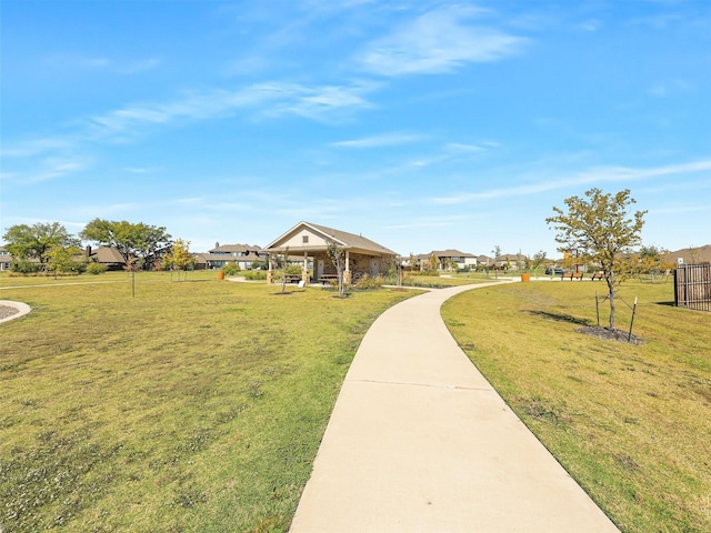 view of property's community with a yard