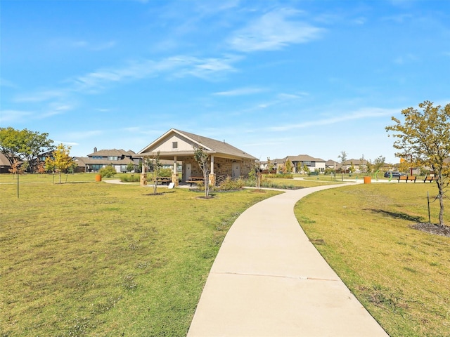 surrounding community featuring a yard