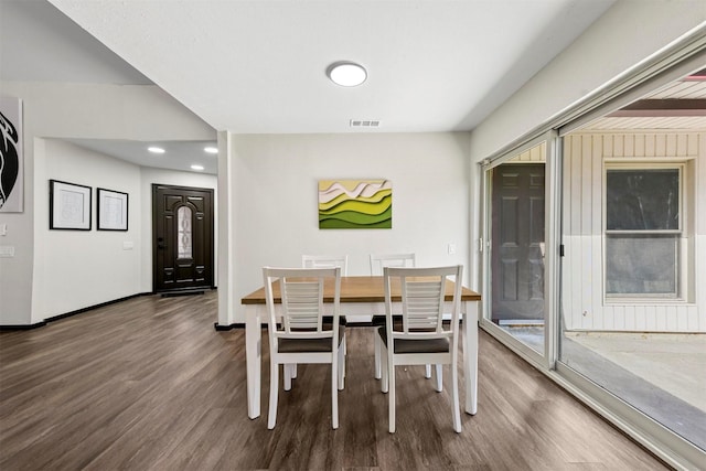 dining area featuring dark hardwood / wood-style flooring