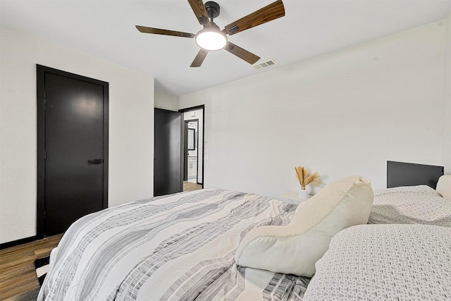 bedroom featuring hardwood / wood-style floors and ceiling fan