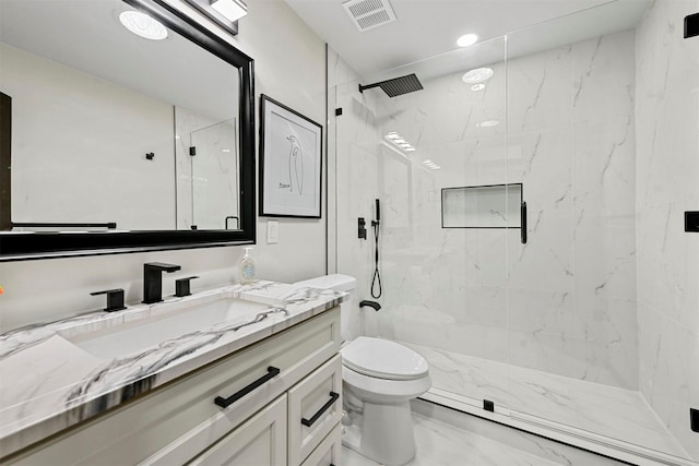 bathroom with toilet, walk in shower, and vanity