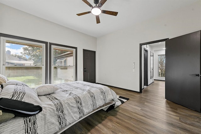 bedroom with ceiling fan and hardwood / wood-style floors