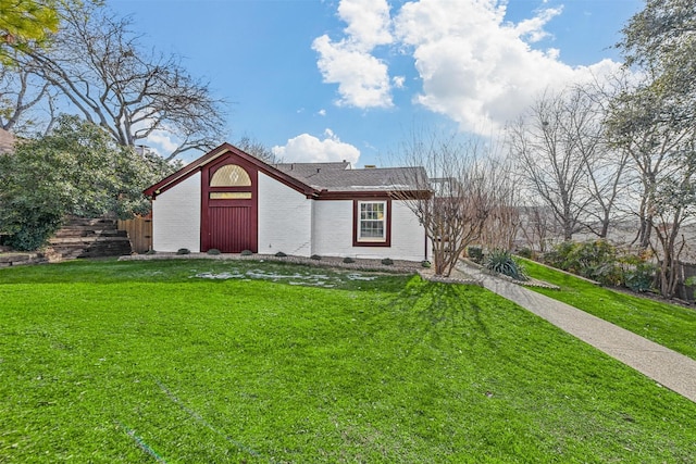 view of outdoor structure with a lawn