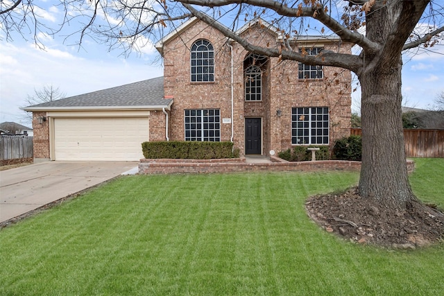 view of front of home featuring a garage and a front yard