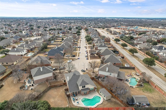 birds eye view of property with a residential view