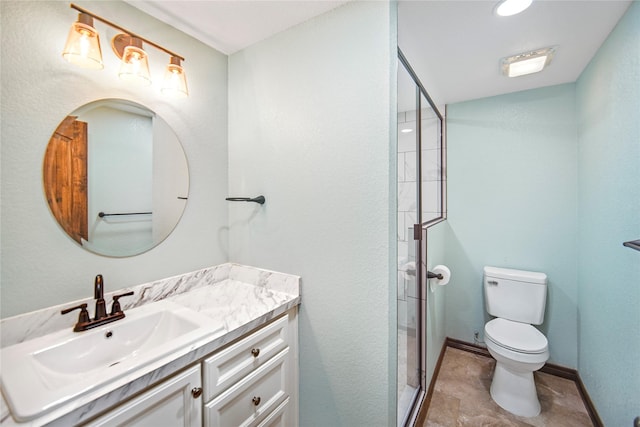 bathroom featuring toilet, a shower with door, and vanity