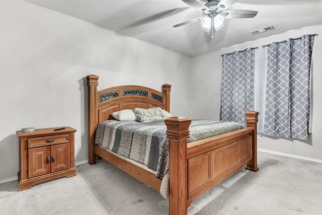 bedroom featuring ceiling fan and light carpet