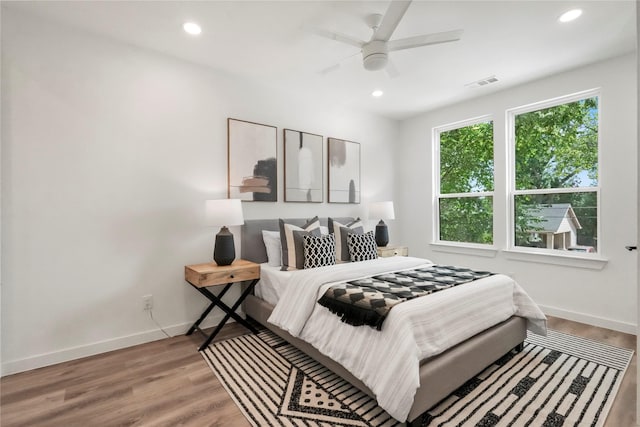 bedroom featuring ceiling fan and hardwood / wood-style flooring