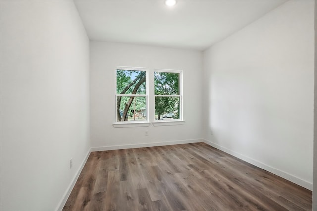 empty room with wood-type flooring