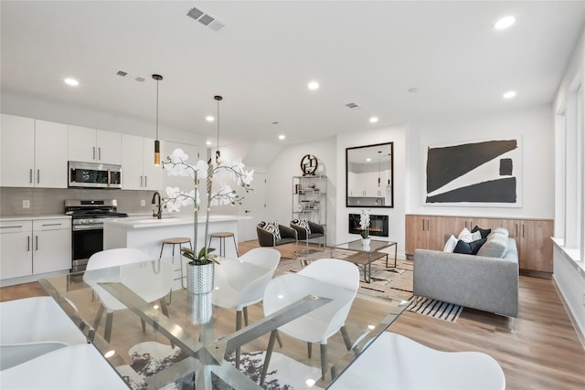 dining space featuring light hardwood / wood-style floors