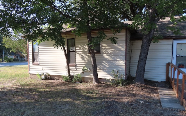 view of home's exterior featuring a lawn