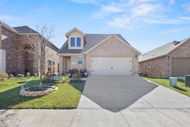 view of front of home with a garage, cooling unit, and a front lawn