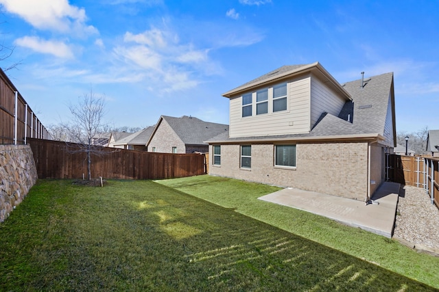 rear view of property with a patio and a lawn