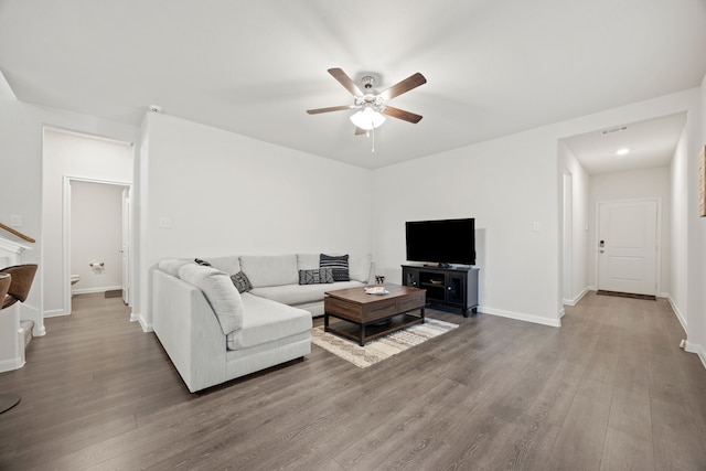 living room with hardwood / wood-style floors and ceiling fan